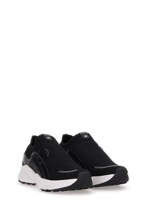 Michael Kors women’s sneaker trainer black with black mesh slip-on design white rubber sole and glossy black accents