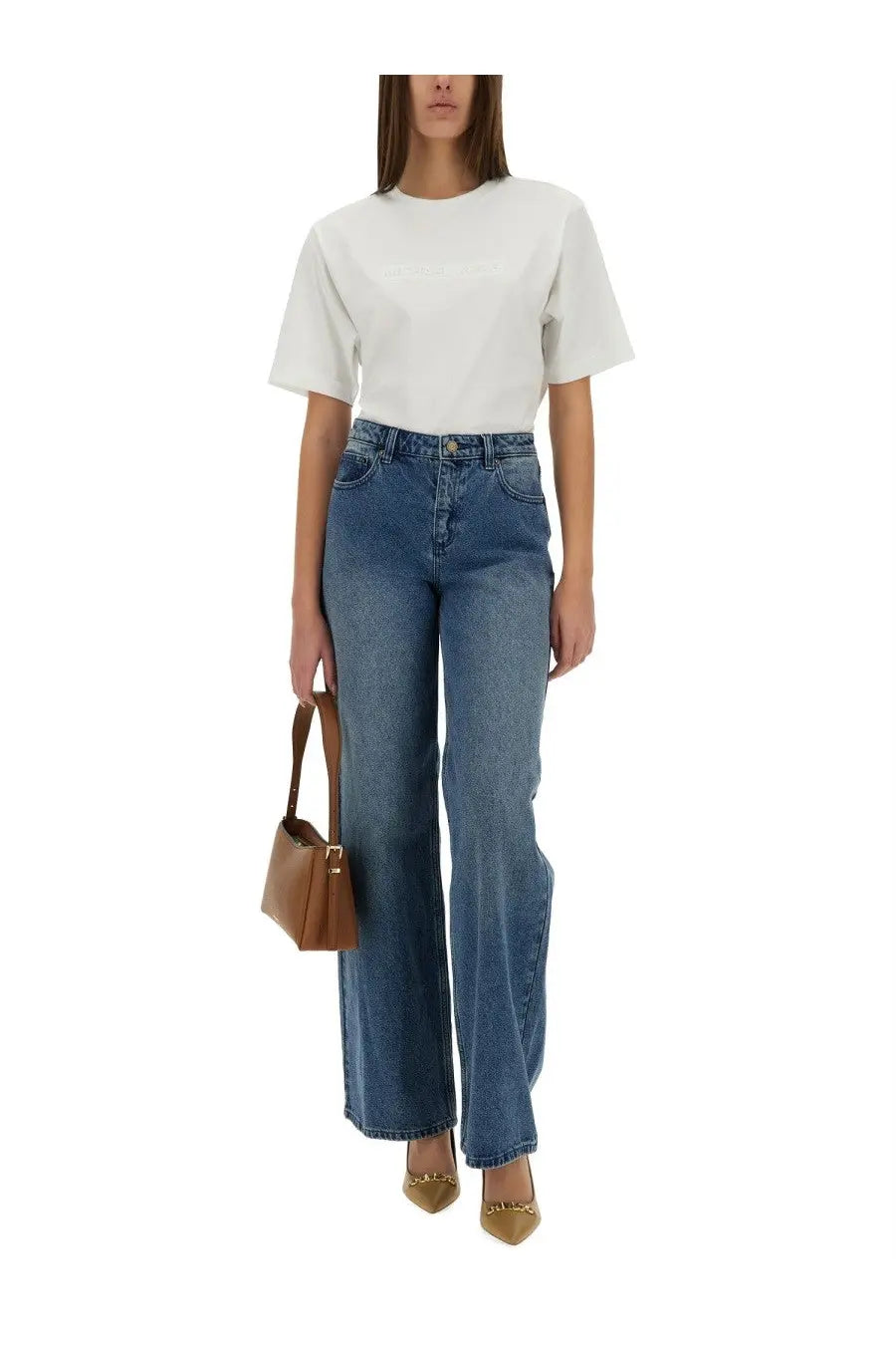 A tan leather handbag with a structured minimalist design and gold-tone hardware paired with michael kors womens straight leg blue jeans