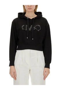 Michael Kors women’s black cropped hoodie with shiny reflective logo across the chest in soft sweatshirt material