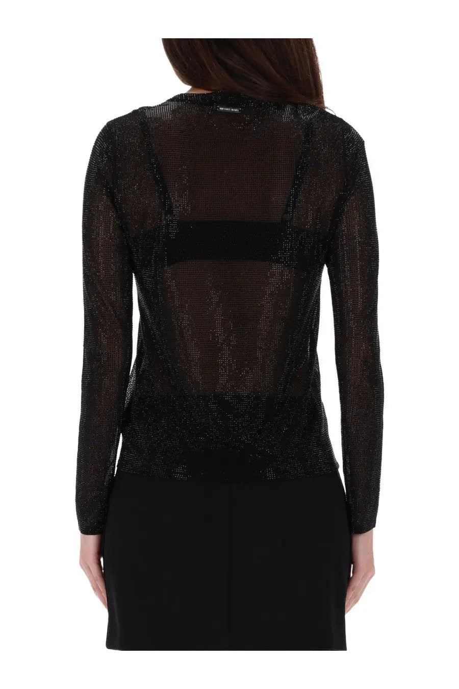 Back view of michael kors women’s black sheer long-sleeved top with sparkling textured fabric and solid band