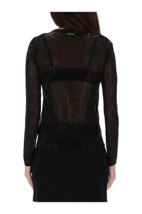 Black sheer long-sleeved top by Michael Kors with sparkling textured fabric and solid black horizontal band on back