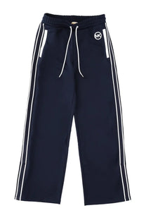 Michael Kors women’s navy blue tracksuit pants with white side stripes and matching drawstring waistband