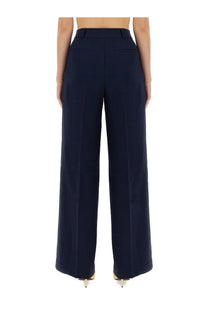 Michael Kors women’s navy blue high-waisted wide-leg trousers with tailored fit and front pockets