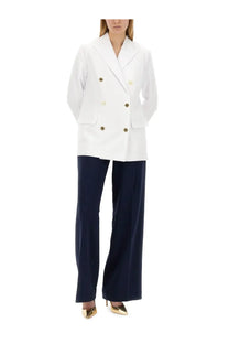 White double-breasted blazer with gold-toned buttons paired with michael kors women’s wide leg blue pants