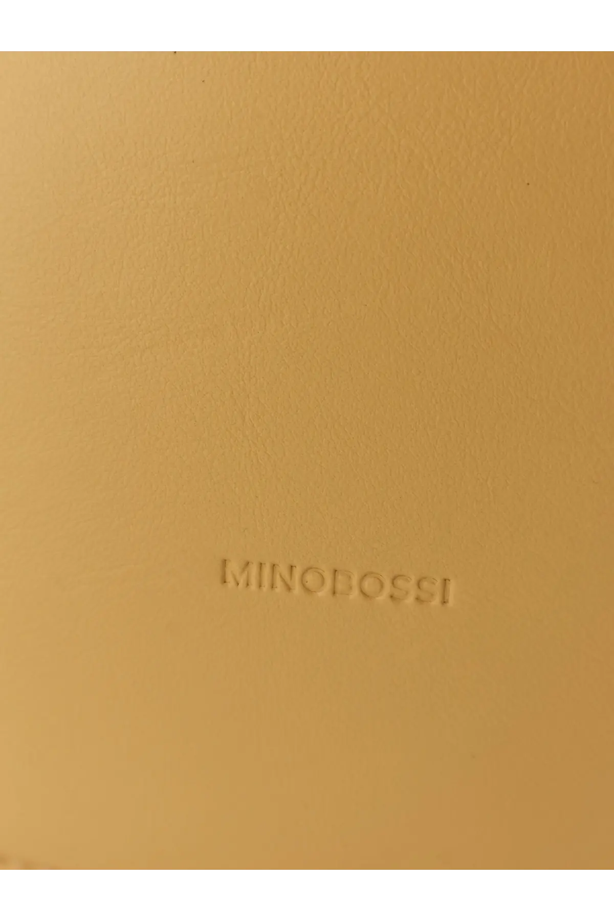 Beige leather notebook with embossed minobossi branding complementing minobossi women’s liz leather crossbody bag yellow