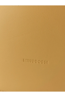 Beige leather notebook with embossed minobossi branding complementing minobossi women’s liz leather crossbody bag yellow