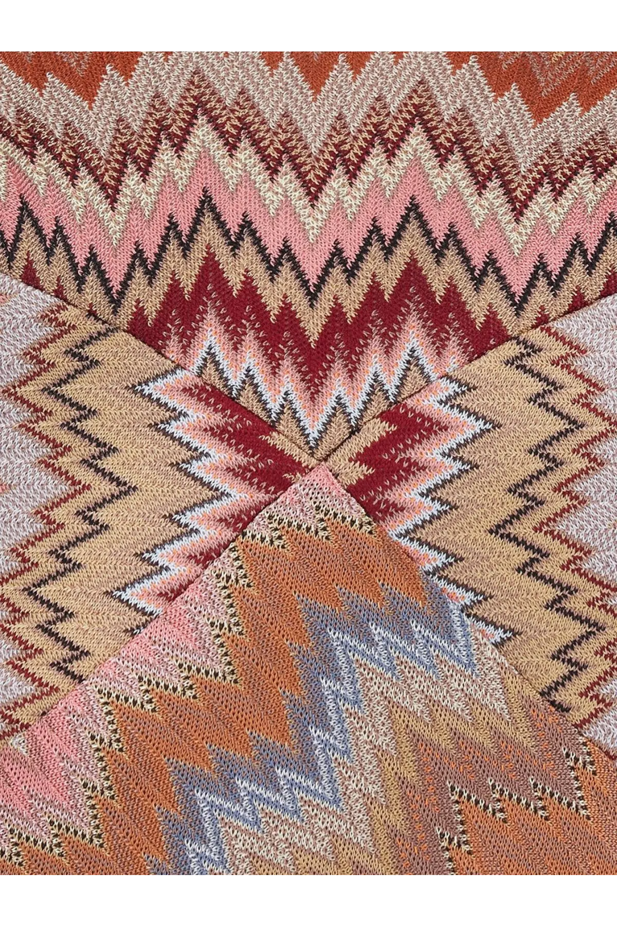 A knitted scarf with a bold zigzag pattern in pink red beige and gray paired with missoni women’s long viscose dress brown