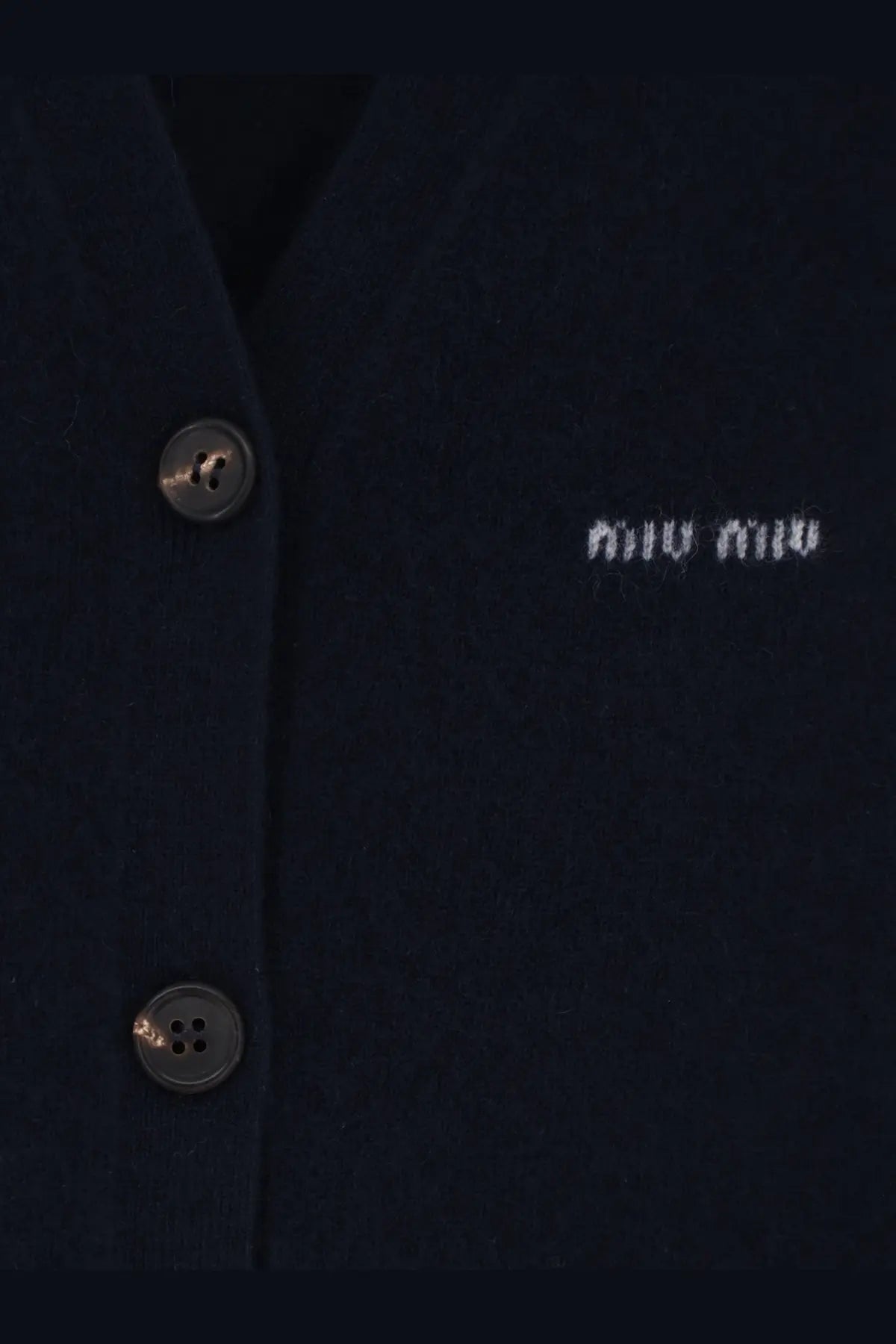 Dark navy miu miu women’s cashmere cardigan with silver-toned buttons and subtle white embroidered logo