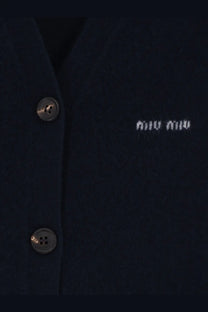 Dark navy miu miu women’s cashmere cardigan with silver-toned buttons and subtle white embroidered logo