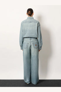 Miu Miu women’s cotton light-wash denim jeans with a relaxed wide-leg cut and subtle stitching details