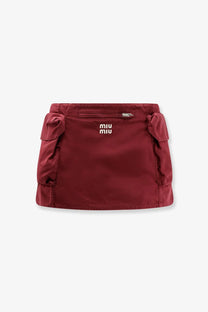 Miu Miu women’s red cotton mini skirt with front zippered pocket and side pockets, stylish and functional design