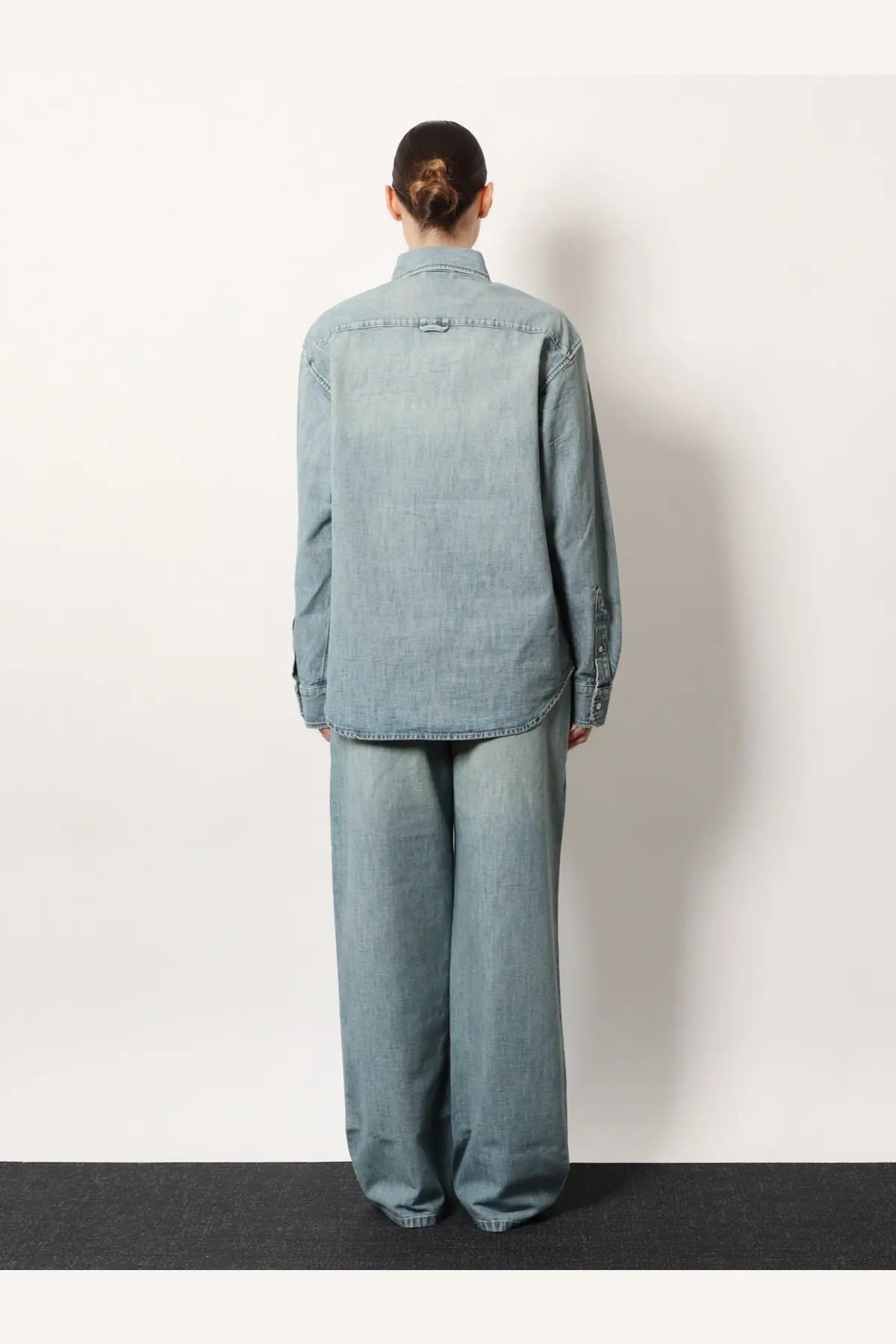 Miu Miu women’s denim shirt in light blue with relaxed fit and subtle distressing details made of denim