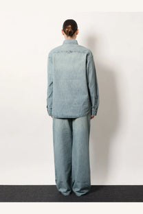 Miu Miu women’s denim shirt in light blue with relaxed fit and subtle distressing details made of denim