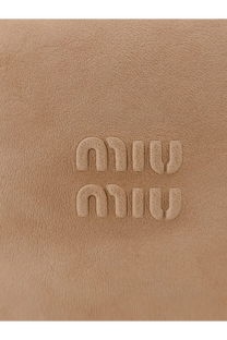 Tan leather pouch handbag with embossed miu miu logo in beige for women
