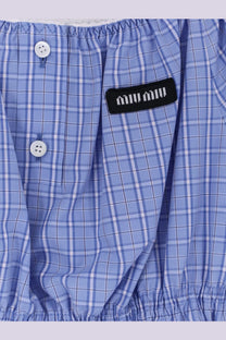 Light blue and white plaid miu miu boxer shorts with a black embroidered brand patch in cotton fabric