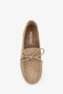 Miu Miu women’s beige suede loafers with tied lace detail and stitched seams