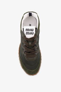 Green miu miu women’s sneaker in olive suede and canvas with brown braided laces and gum rubber sole