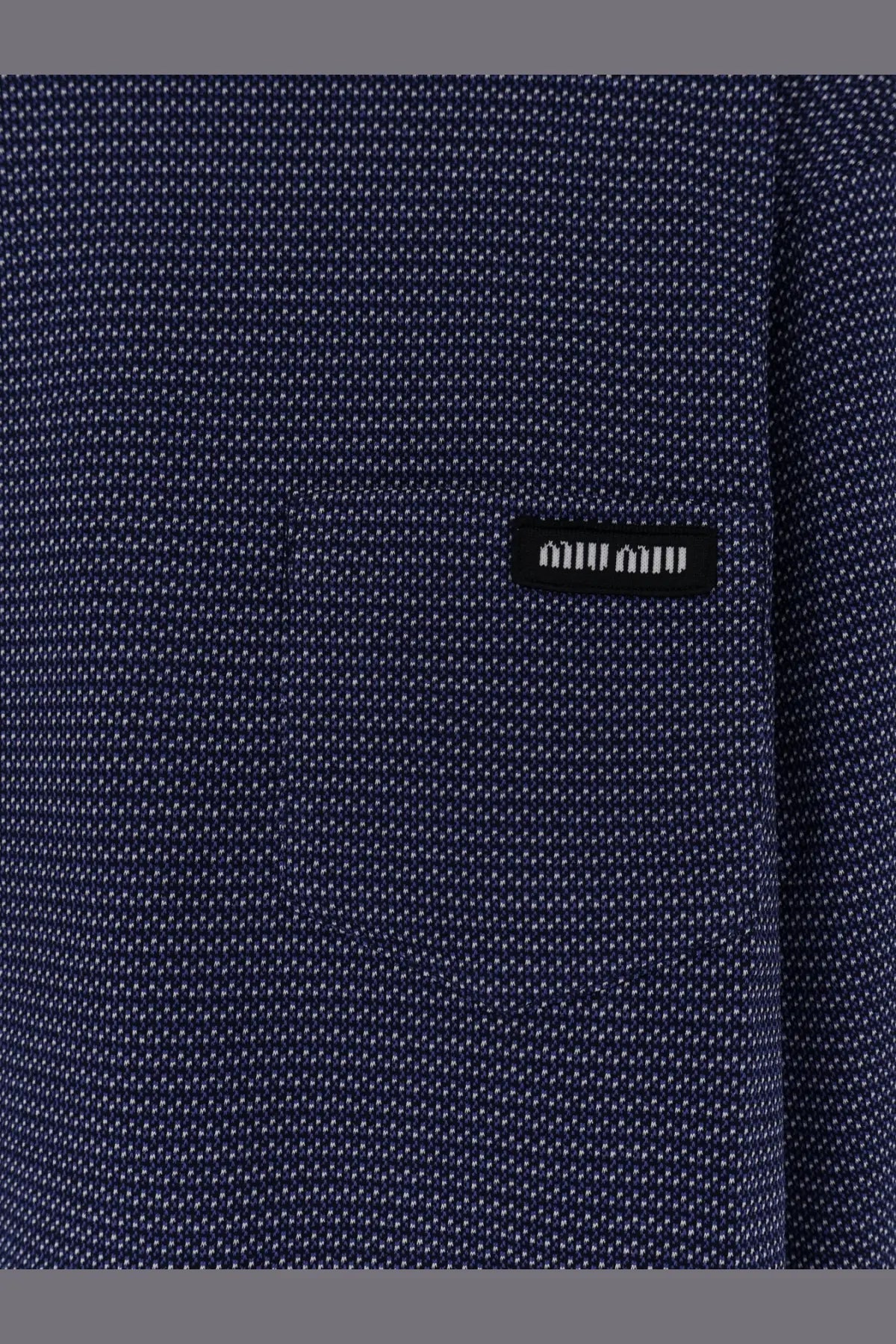 Miu Miu women’s two tone jersey shirt white with dark blue textured fabric and black logo patch with white dots