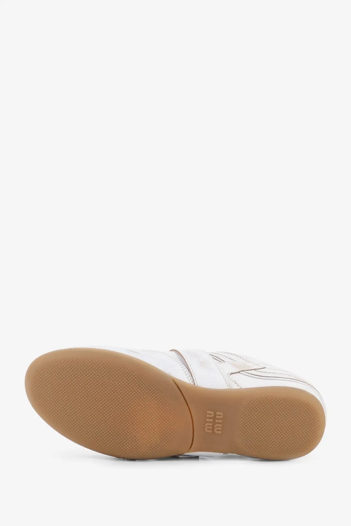 Miu Miu women’s used effect white leather sneakers with tan rubber sole and subtle stitching details