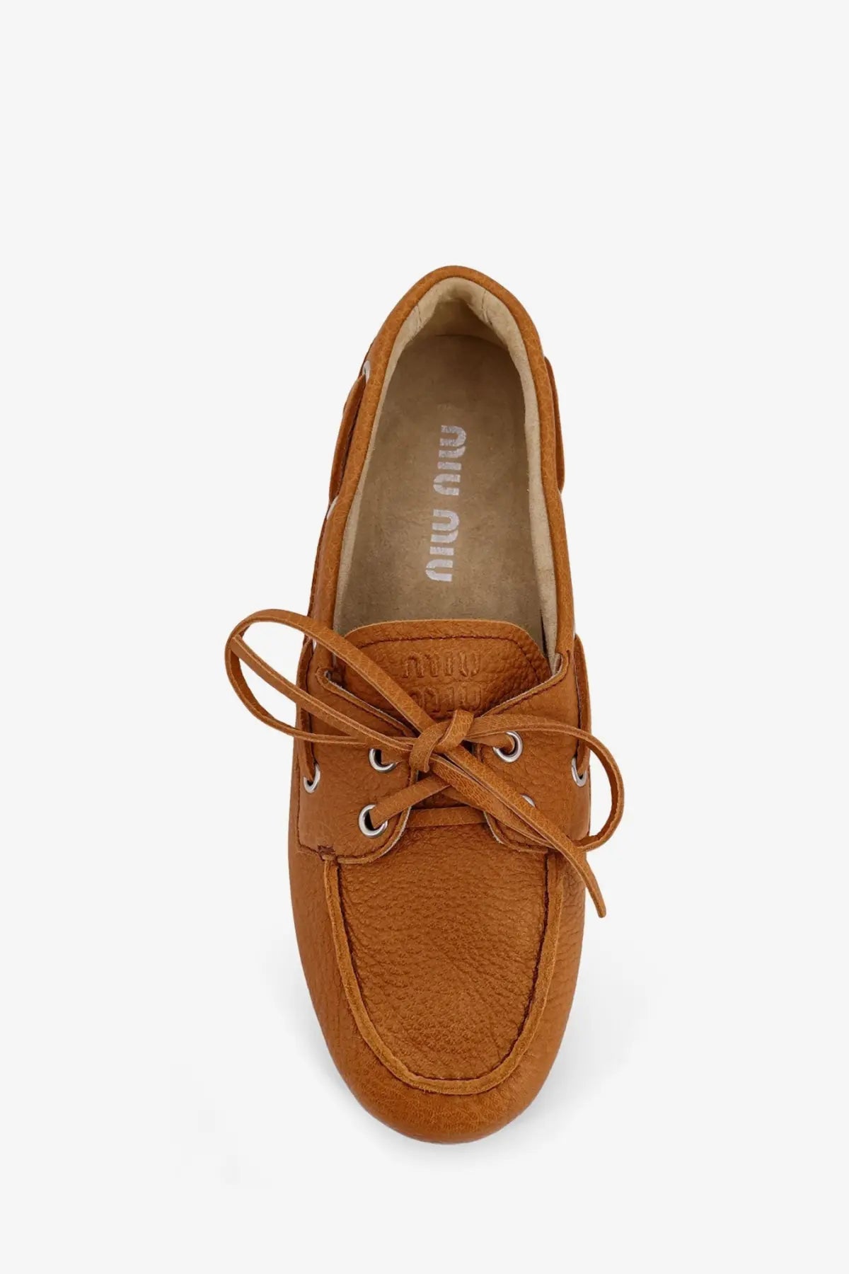 Miu Miu women’s vintage effect leather loafers in tan with tied laces and silver eyelets boat shoe style