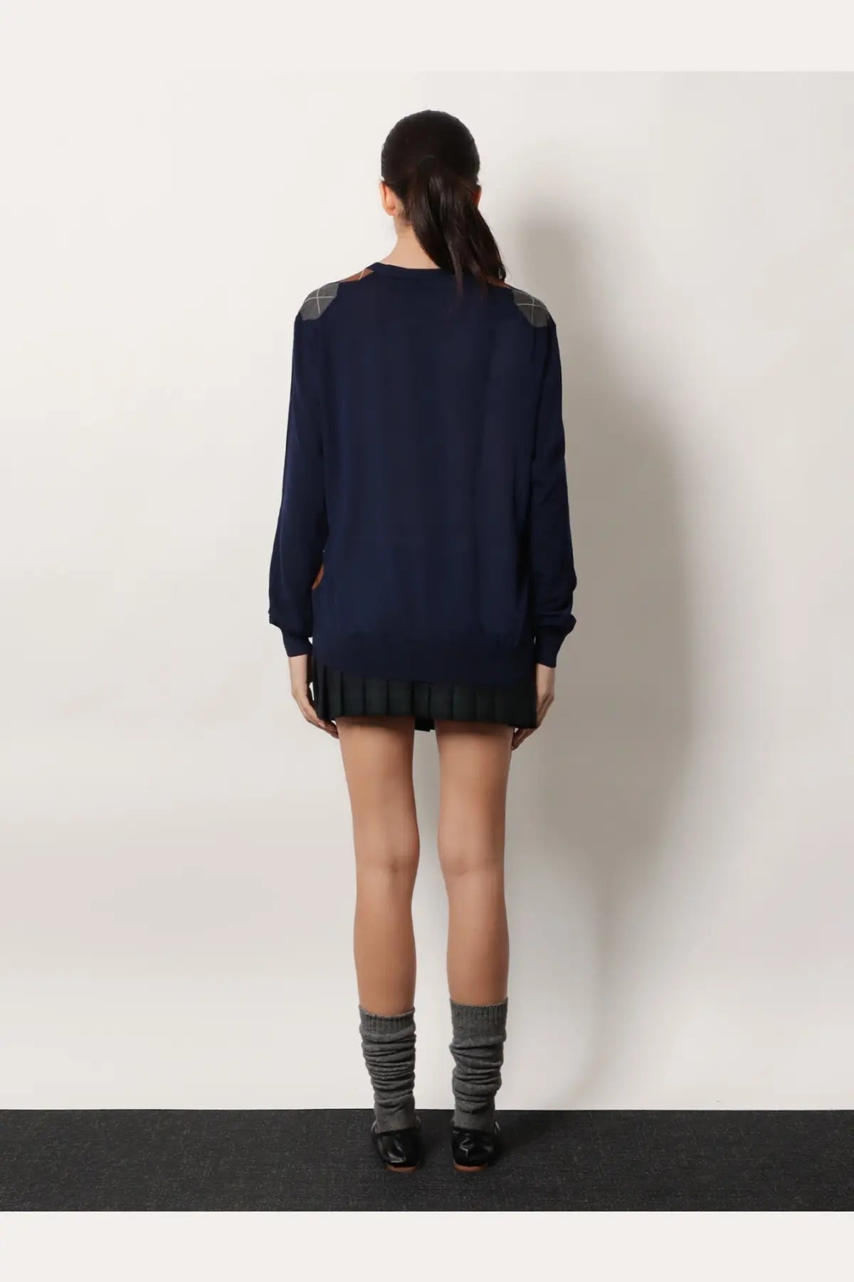 Miu Miu women’s navy blue virgin wool sweater dress with gray argyle shoulder panels and black pleated hem