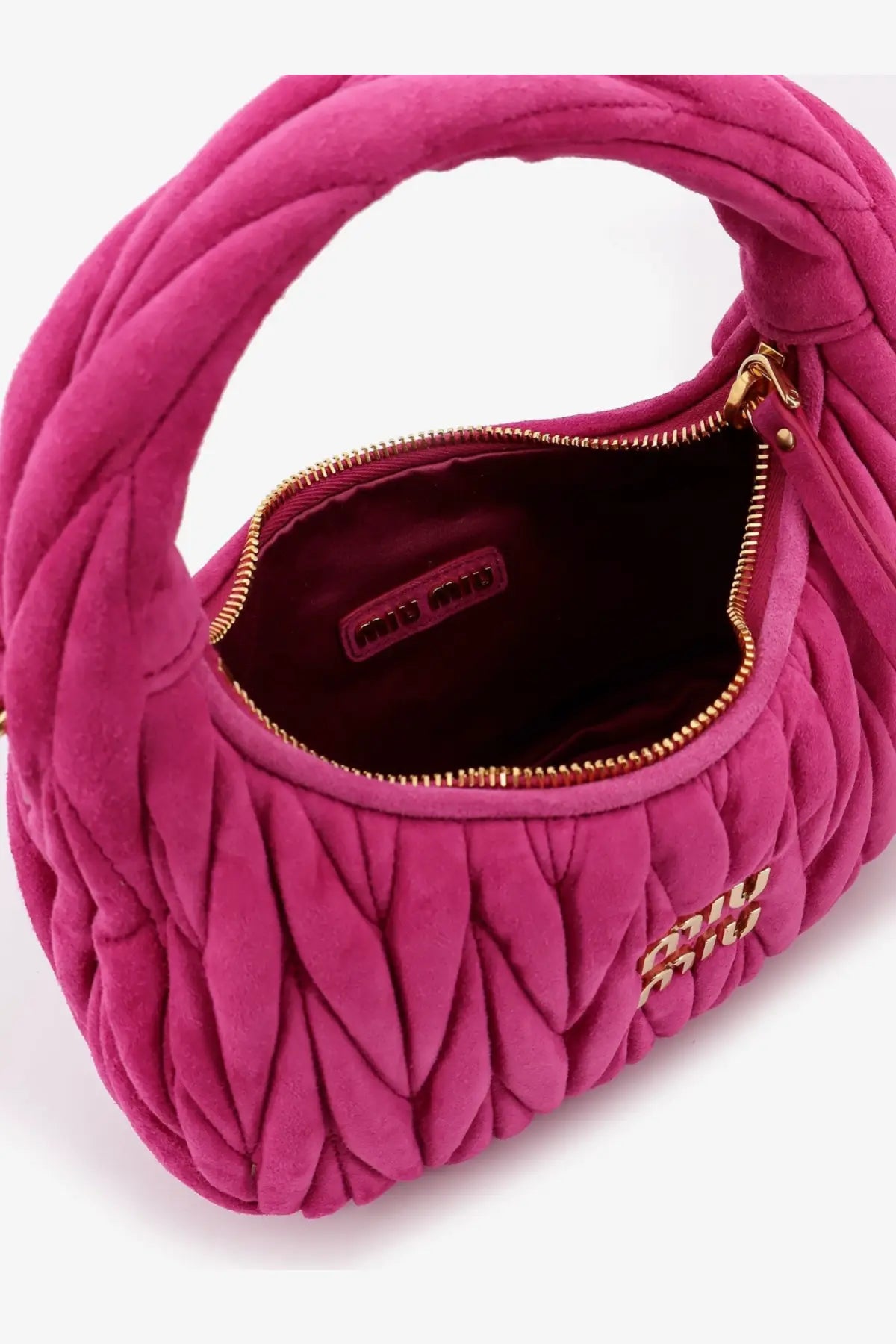 A vibrant fuchsia miu miu women’s wander matelassé suede shoulder bag with quilted velvet texture and gold-tone hardware