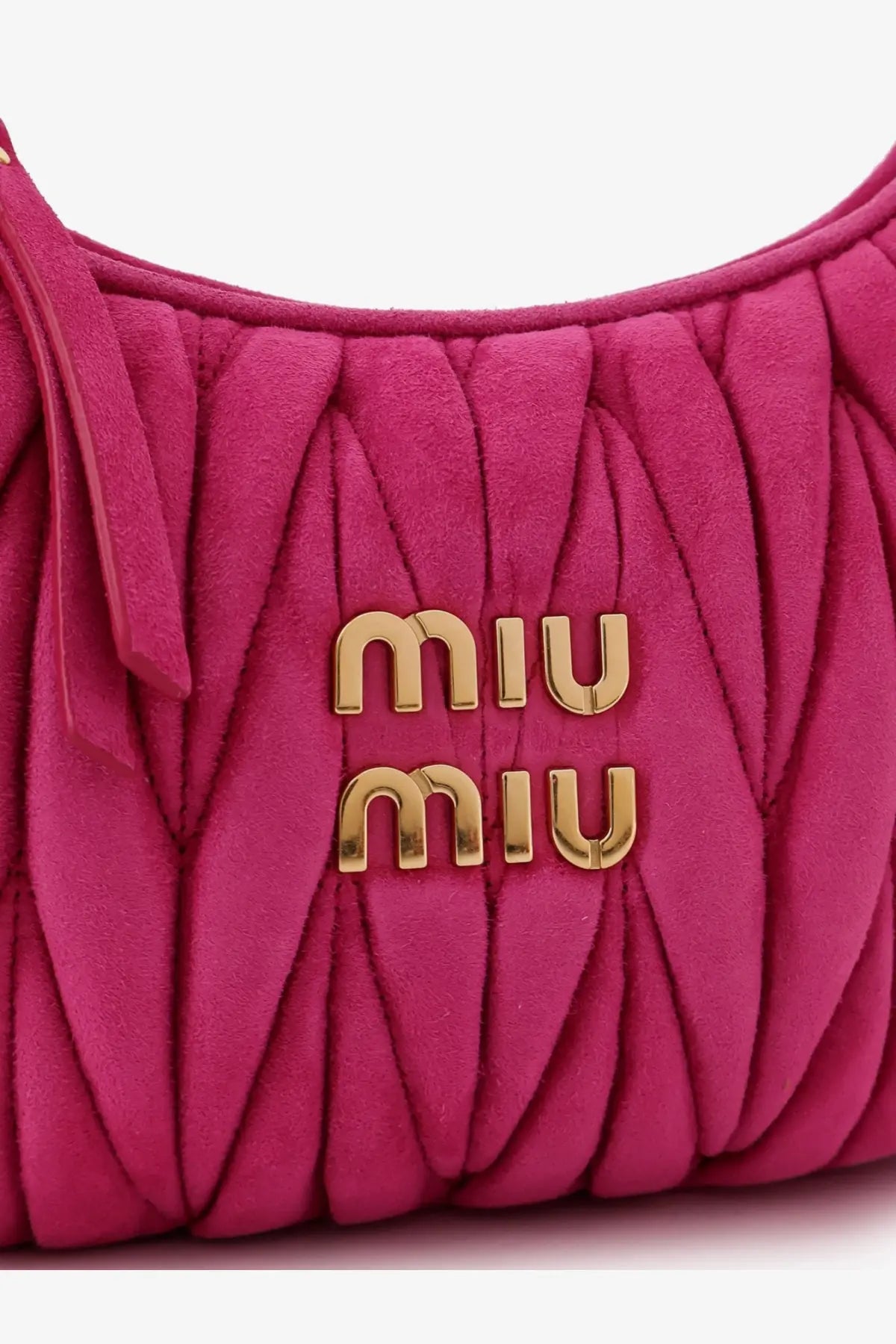 A vibrant fuchsia Miu Miu women’s Wander Matelassé suede shoulder bag with quilted texture and gold-tone logo hardware