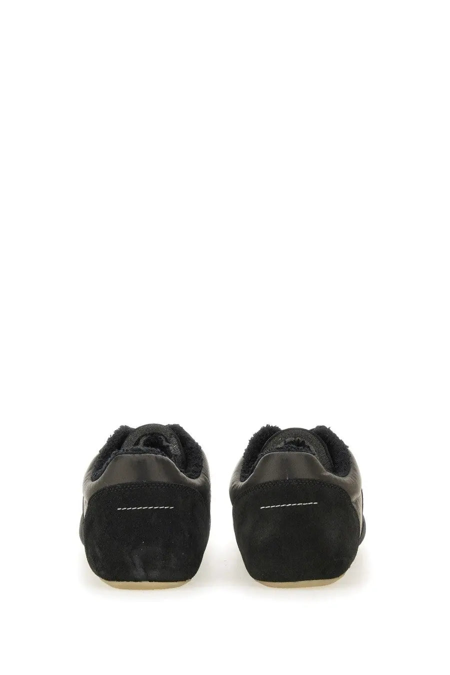 Back view of mm6 maison margiela men’s anatomic black suede sneakers with plush fuzzy lining and white heel stitching