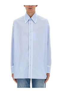 Light blue oversized button-down shirt with crisp collar and matching buttons from MM6 Maison Margiela men’s collection