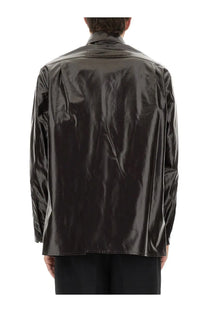 Black glossy patent leather jacket with structured collar and long sleeves paired with mm6 maison margiela brown shiny linen shirt