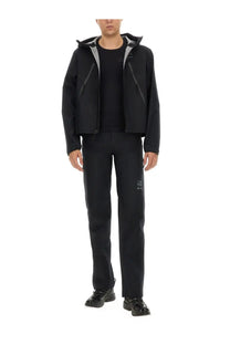 Black hooded jacket with gray inner lining and subtle branding details paired with mm6 maison margiela men’s black straight leg pants
