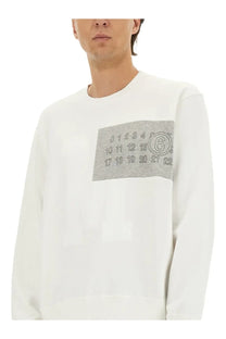 White MM6 Maison Margiela men’s crewneck sweatshirt with gray patch featuring black numerals and circled number six
