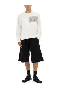 White long-sleeved cotton sweatshirt with gray rectangular patch and printed text by mm6 maison margiela men