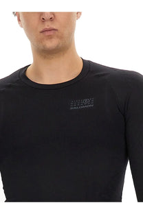 Black salomon long sleeve performance shirt with subtle gray logo made from technical fabric for men by mm6 maison margiela
