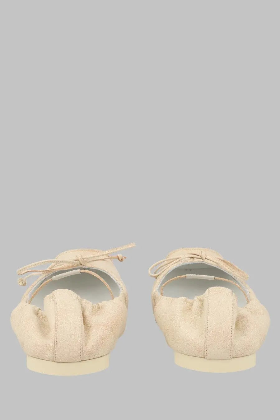 Mm6 Maison Margiela cream-colored suede ballet flats with delicate lace-up ties and soft flexible design in beige
