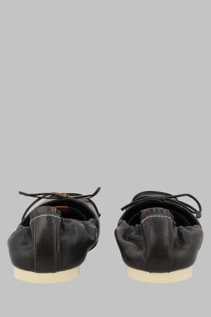 Mm6 Maison Margiela women’s black leather ballet flats with soft wrinkled texture and white contrast stitching