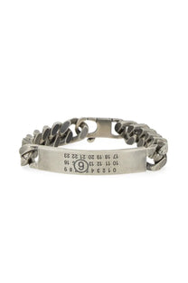 Silver-toned chain bracelet with engraved rectangular plate featuring numbers and number 9 circle by mm6 maison margiela