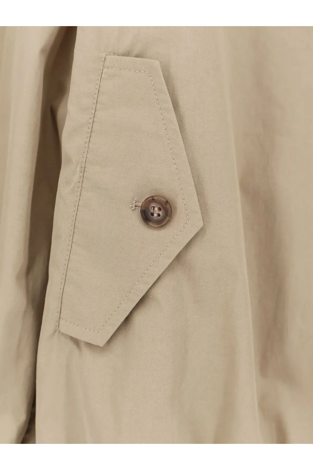 Beige cotton trench coat pocket with brown button and matching stitching on mm6 maison margiela women’s jacket