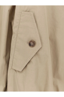 Beige cotton trench coat pocket with brown button and matching stitching on mm6 maison margiela women’s jacket