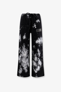 Mm6 maison margiela women’s black cotton jogging trousers with wide legs cosmic white splatter print and drawstring waist