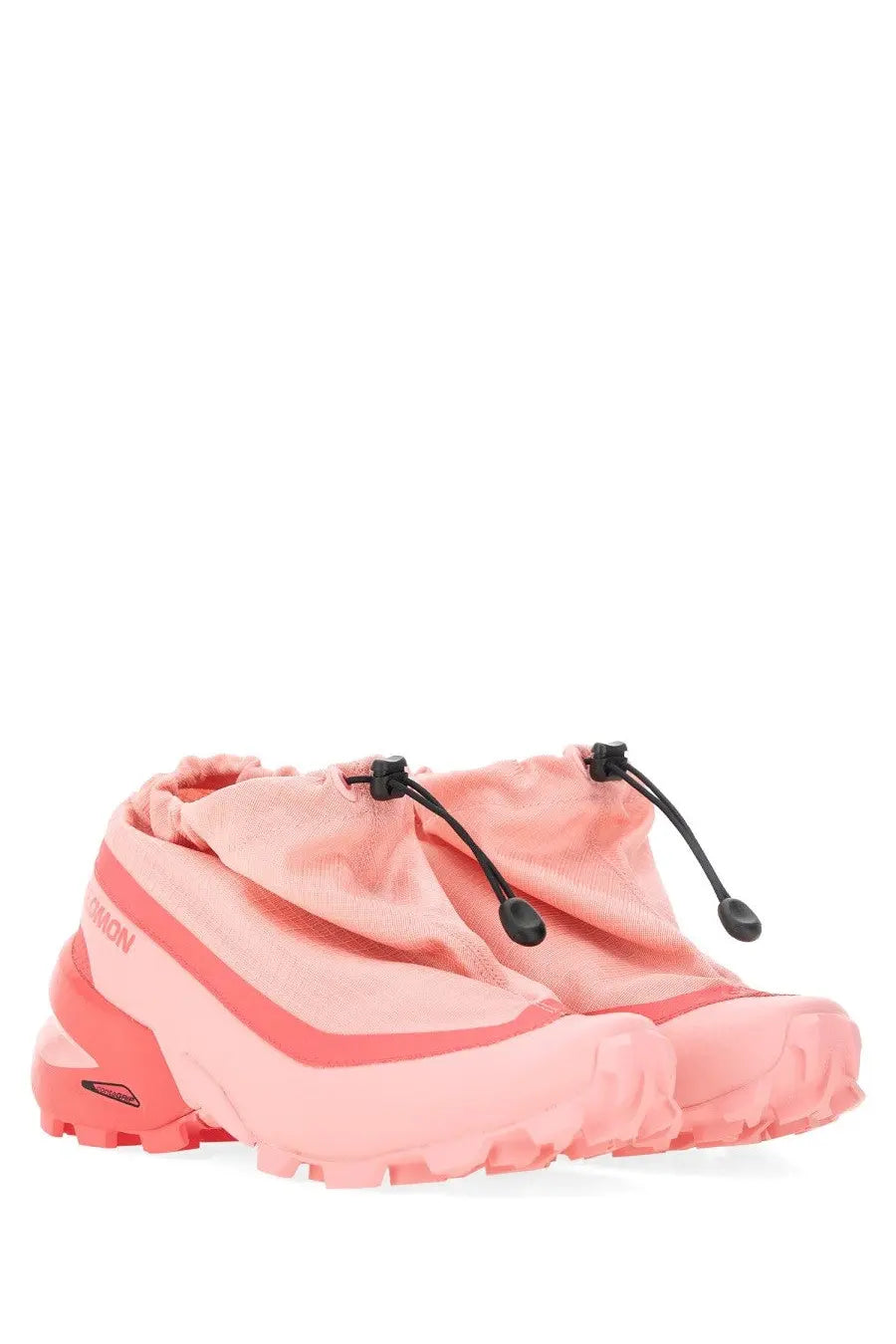 Pink Salomon trail running shoes with mesh upper and rubber outsole designed for outdoor running use