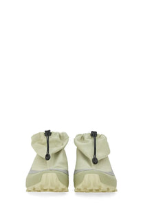 Mm6 maison margiela women’s cross low sneaker in light green with high-top drawstring closure and rugged rubber soles