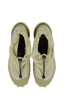 Light green mm6 maison margiela women’s cross low sneaker with drawstring closure and textured upper material