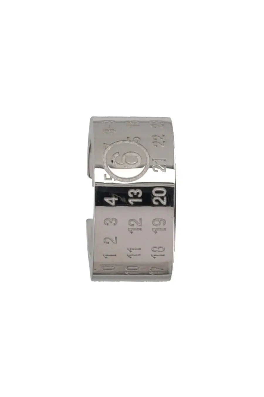 Silver-toned metal ear cuff by MM6 Maison Margiela with engraved calendar numbers and central circular emblem