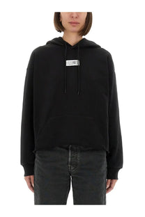 Mm6 maison margiela women’s black oversized hoodie with white rectangular logo patch and matching drawstrings