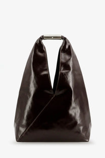 A sleek black leather tote bag with a minimalist metallic handle in mm6 maison margiela style