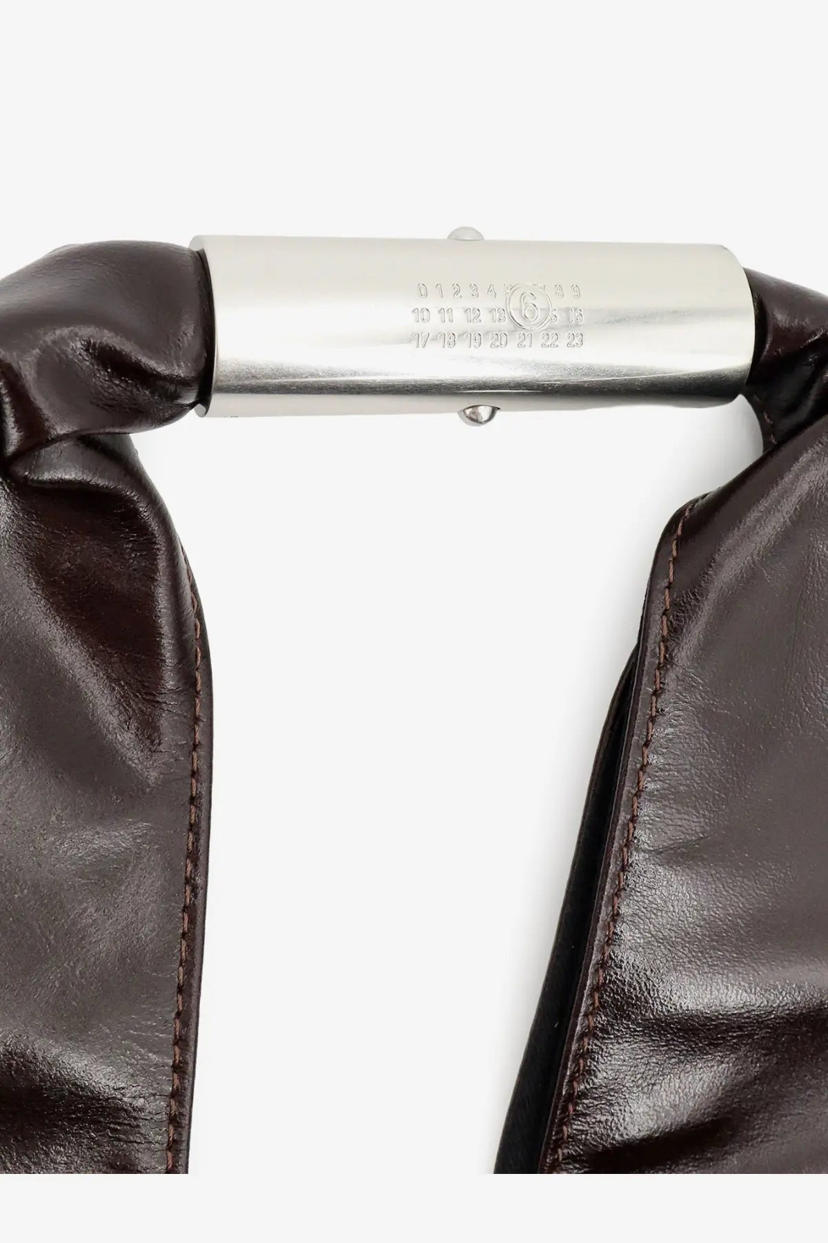 Dark brown leather strap with polished silver clasp and engravings on mm6 maison margiela japanese shiny leather shoulder bag