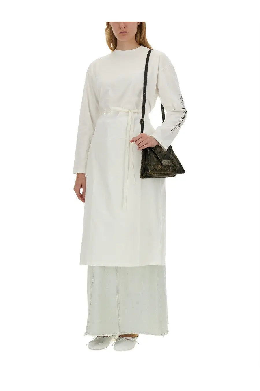 Black leather crossbody bag with rectangular flap and metallic hardware paired with mm6 maison margiela white jersey shirt
