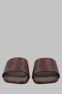 Brown leather slide sandals with minimalist design and embossed logo on strap mm6 maison margiela women’s sandalo anatomic con tacco brown