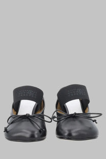 Black leather mary jane flats with bow tie and elastic strap across instep MM6 Maison Margiela women’s sandalo numeric anatomic con tacco black